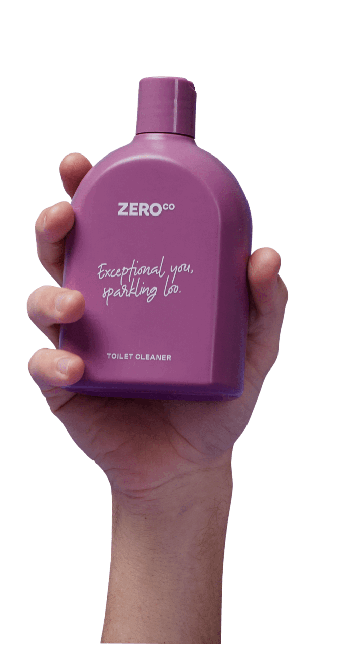 Hand holding up a bottle of Zeroco product
